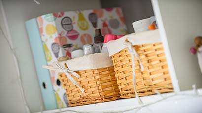 Close up of a shelf with folders and beauty products