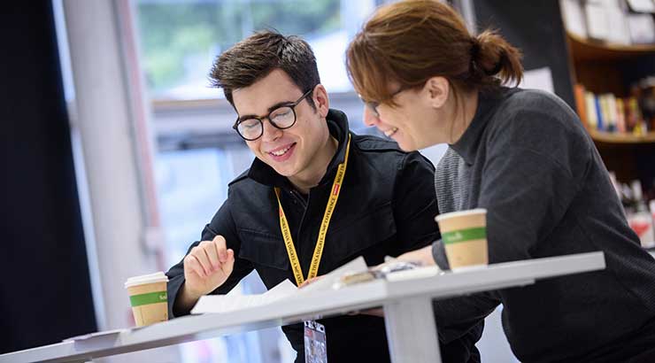 A couple of people looking at paperwork