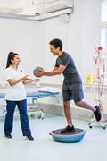 Physio student provides balance training exercises to patient
