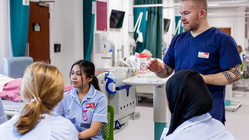 A group of Adult Nursing students in the Skills Simulation Suite on Glenside Campus.