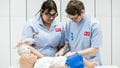 Nursing students with a dummy in the Skills Simulation Suite on Glenside Campus.