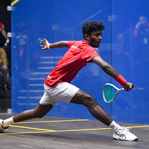 UWE Performance Sport elite squash player lunging for a back hand smash.