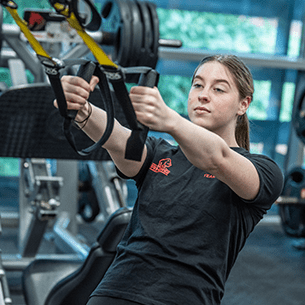 Woman working out using gym equipment at the Centre for Sport, UWE Bristol.