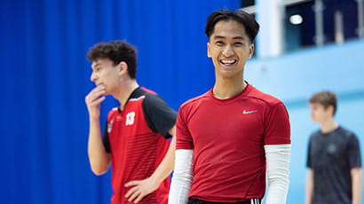 A student in sports clothes smiles to camera during a MOVE session in the Centre for Sport at UWE Bristol.