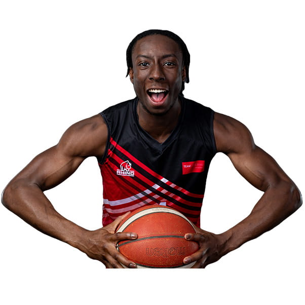 UWE Jets player Corey holding a basketball with both hands and looking to camera.