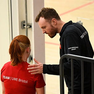 Performance Sport elite squash coach Josh Welton advising a player. 