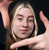 UWE Bristol Performance Sport swim athlete Heather framing her face with her hands.