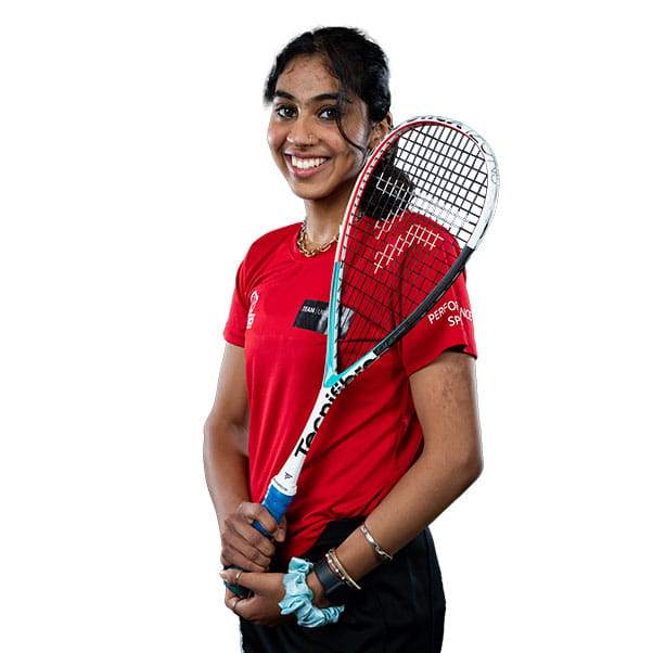 UWE Bristol performance Sport squash player holding her racquet and smiling to camera.