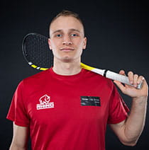 UWE Bristol Performance Sport athlete Filip holding a squash racquet behind his head. 