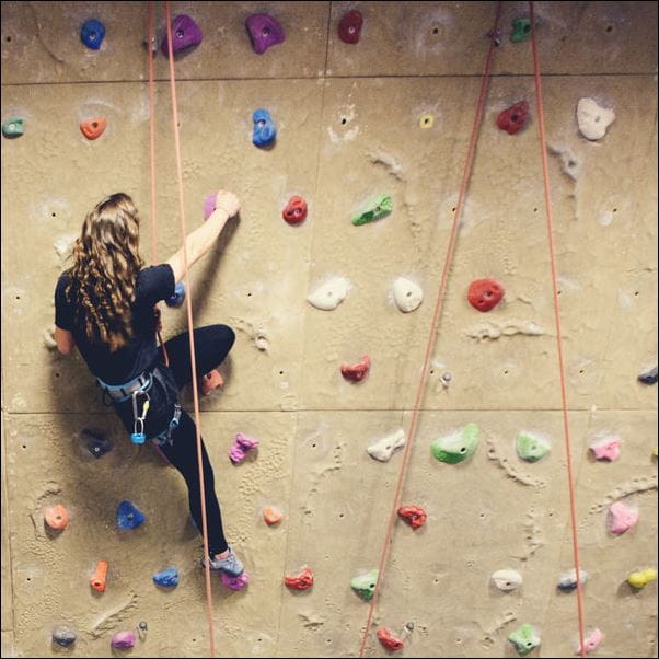 The climbing wall at the Centre for Sport in use.