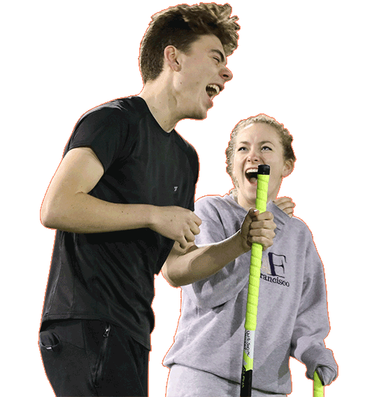 Two students playing hockey at the Centre for Sport.