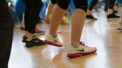 Closeup of legs during an exercise class.