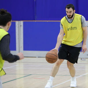 Students playing basketball at the Centre for Sport.