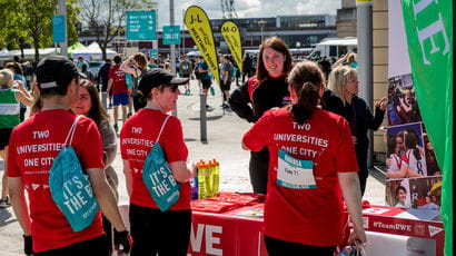 People volunteering at the Bristol 10K.