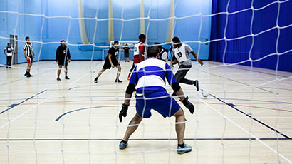 A team playing football at the Centre for Sport sports hall