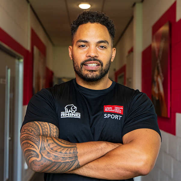 UWE Sport personal trainer Sharief Adrissi looking to camera with arms folded.