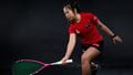 UWE Performance Sport squash athlete Wai taking a tight forehand shot.