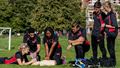 Sport Rehabilitation students outdoors practising CPR