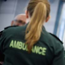 An ambulance worker working a jacket 