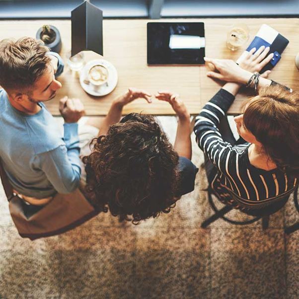 A group of people socializing in a cafe