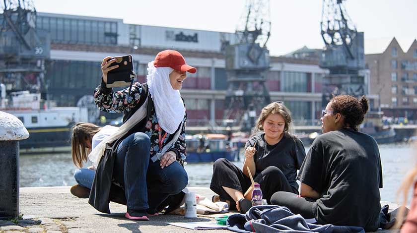 Students sat in front of the MShed in Bristol.