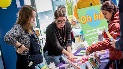 Student comms team chatting to new students at the Welcome Fair.