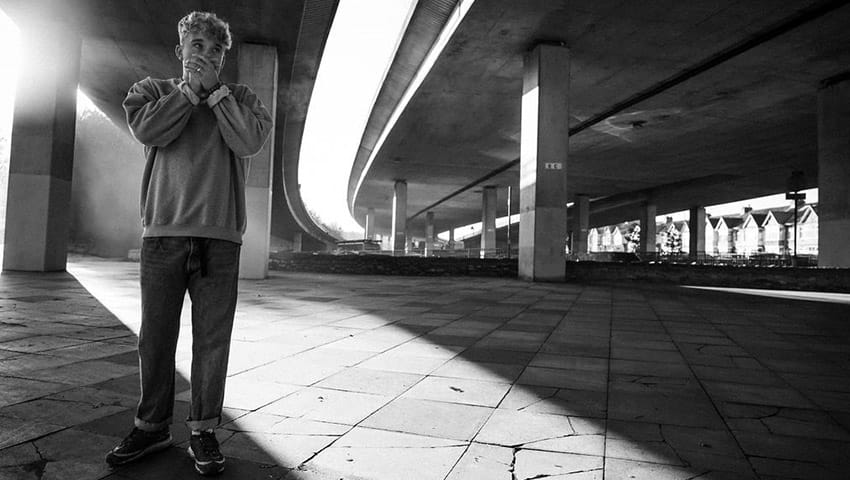 James Tombling short in black and white at an underpass.
