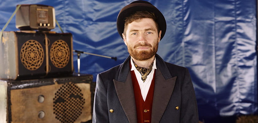 Mike Fergie standing in front of his speakers.