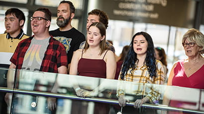 The Technicolour choir performing in public.