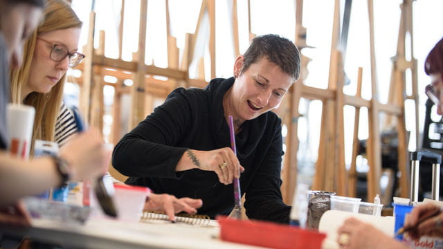 Art students using equipment and facilities