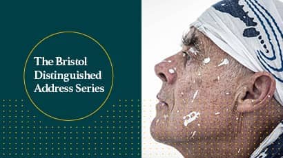 A promotional image for an event with text and the side profile of a man wearing a white bandana 