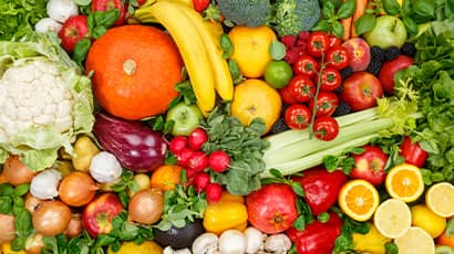 A mixture of colourful fruit and vegetables displayed on a table.