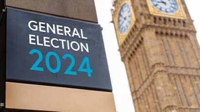 A photo of a sign which says general election 2024 with Big Ben in the background 