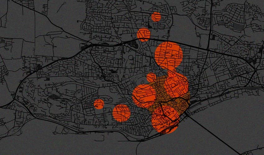 Dark street map with several large orange circles highlighting clustered areas.