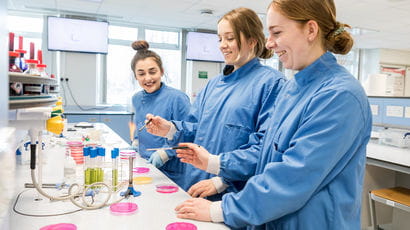 Group of science students doing experiments.