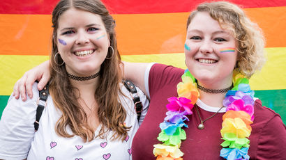 Two women hugging each other. 