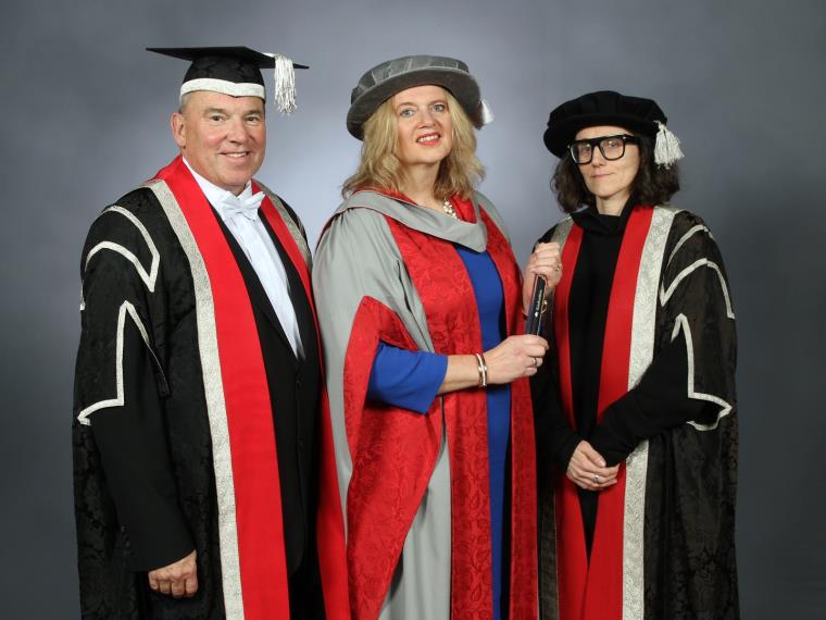 Professor Steve West, Katherine Bennett CBE and Professor Elena Marco in graduation gowns.