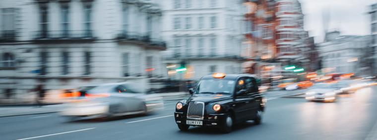 Black London can on a city road