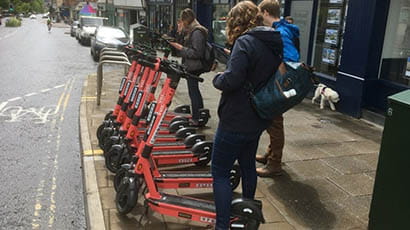 E scooters parked on a Bristol street
