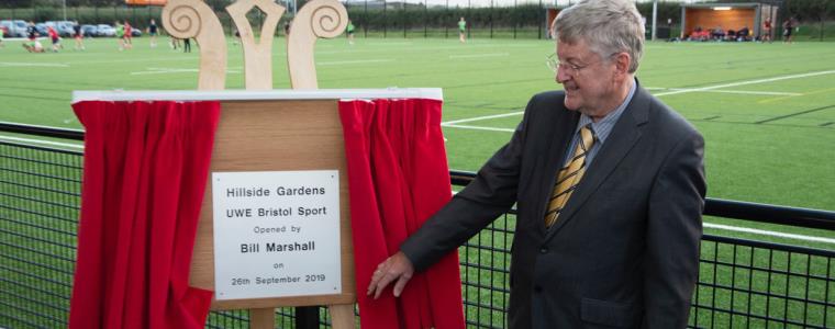 Bill Marshall revealing Hillside Gardens plaque at opening ceremony.