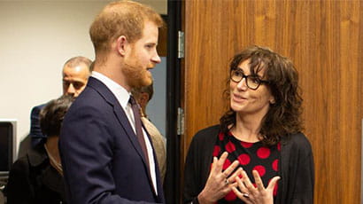 HRH The Duke of Sussex talking to Professor Diana Harcourt.