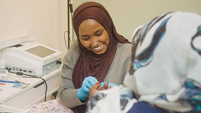 Two people at a community health clinic in Bristol