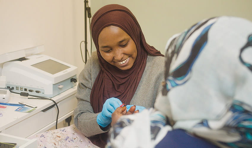 Two people at a community health clinic in Bristol
