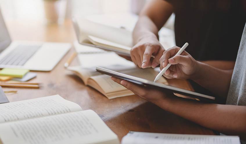 Close-up view of university students discussing their group project