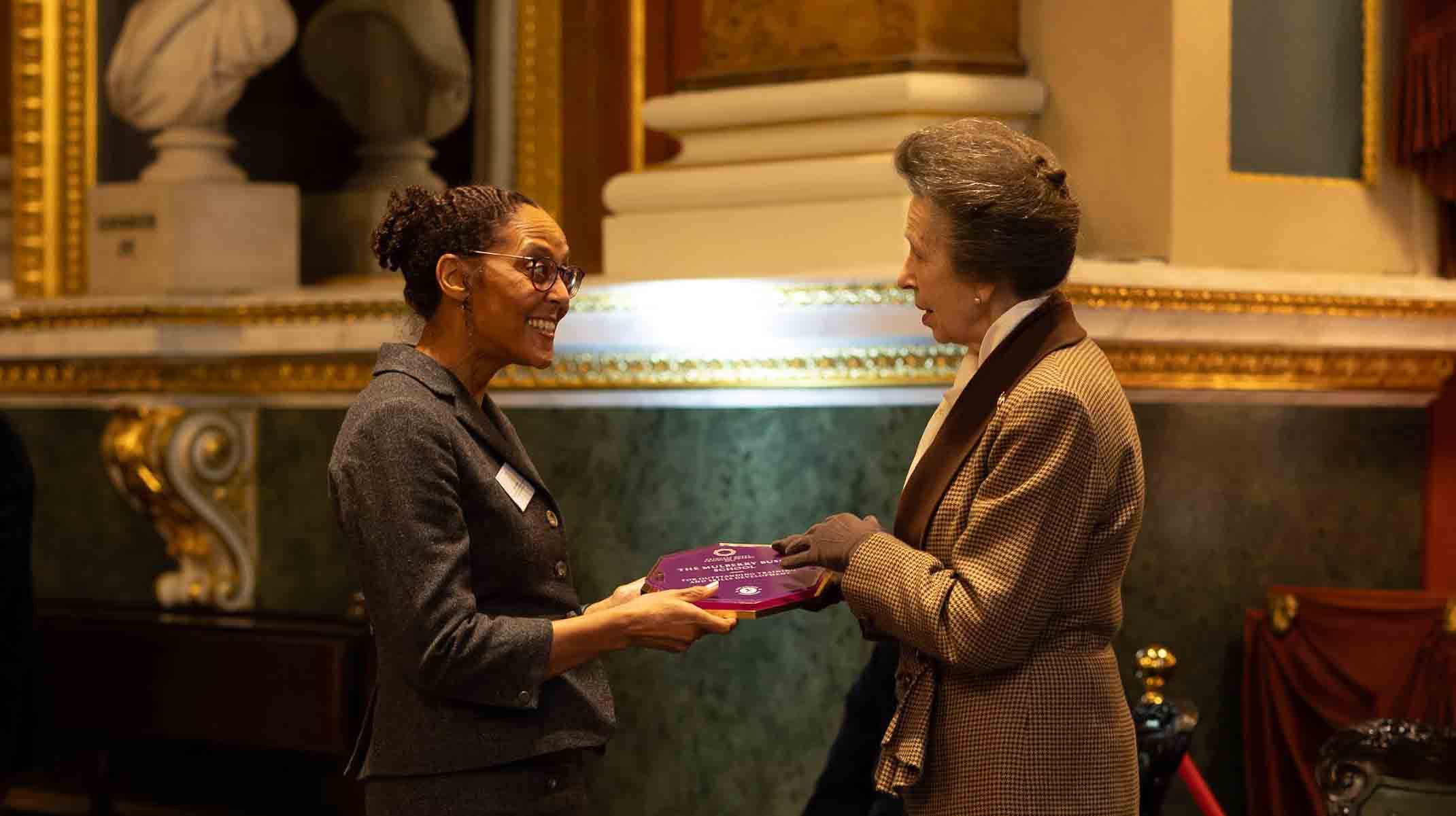 The Princess Royal presenting the award to the Mullberry Bush Charity