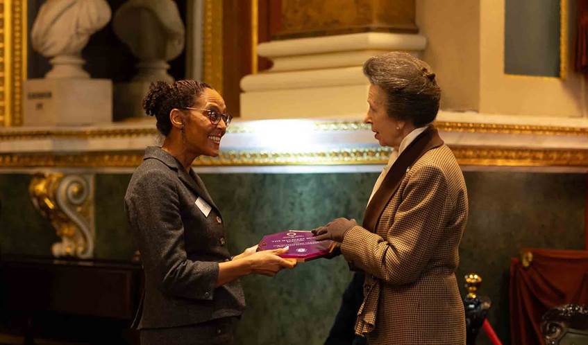 The Princess Royal presenting the award to the Mullberry Bush Charity