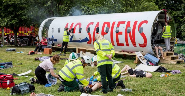 A scenario of a commercial airliner disaster and students practicing their medical skills