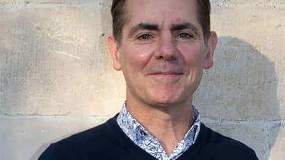 A photograph of Geoff Rich smiling 