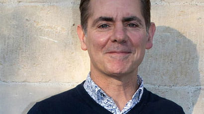 A photograph of Geoff Rich smiling 