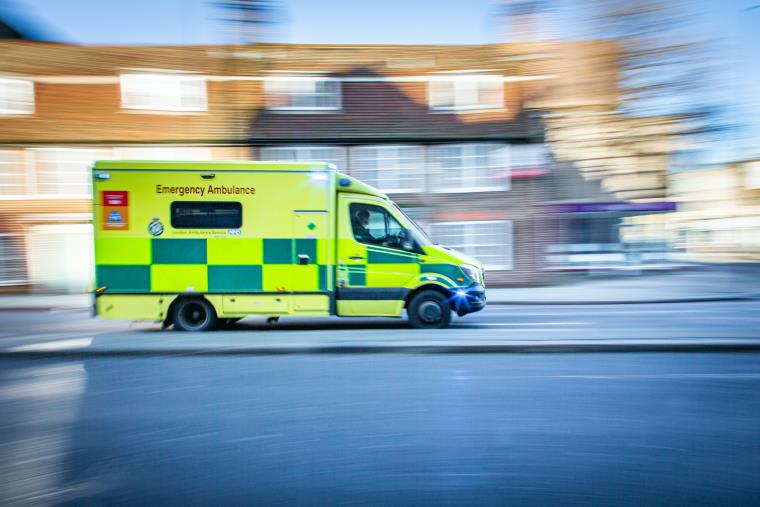 An emergency ambulance driving on the street